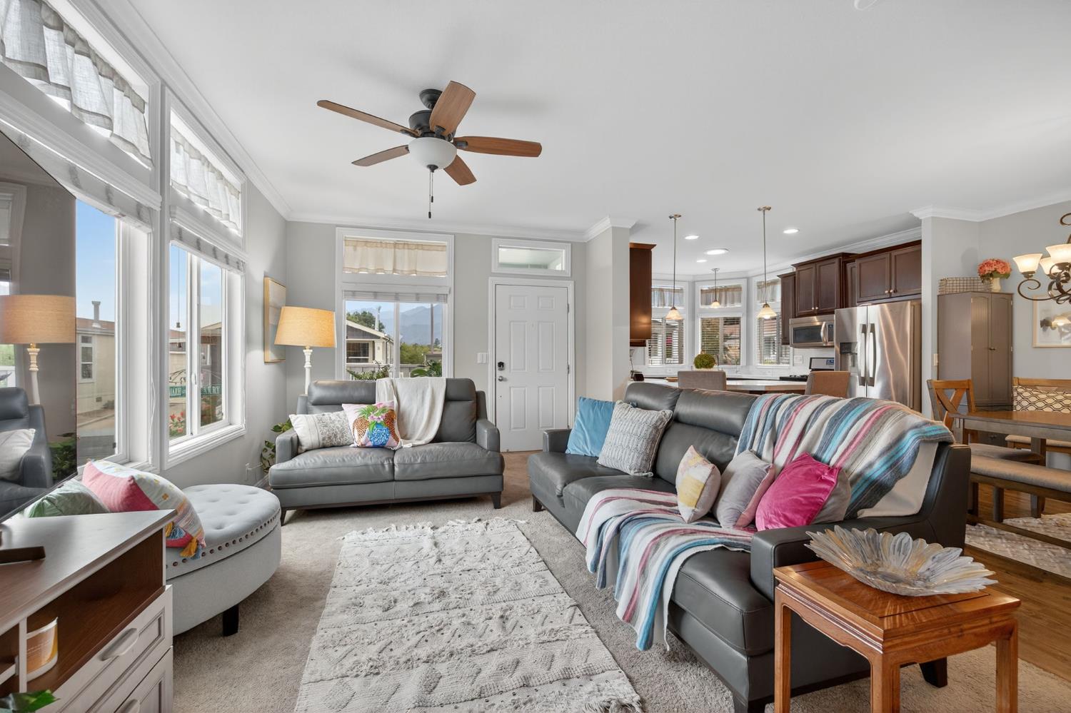 1885 Maricopa Highway, Unit 1 Ojai, CA 93023 - Photo 10 of 36 a living room with furniture ceiling fan and a rug