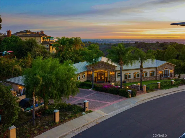a view of house with a street and a yard