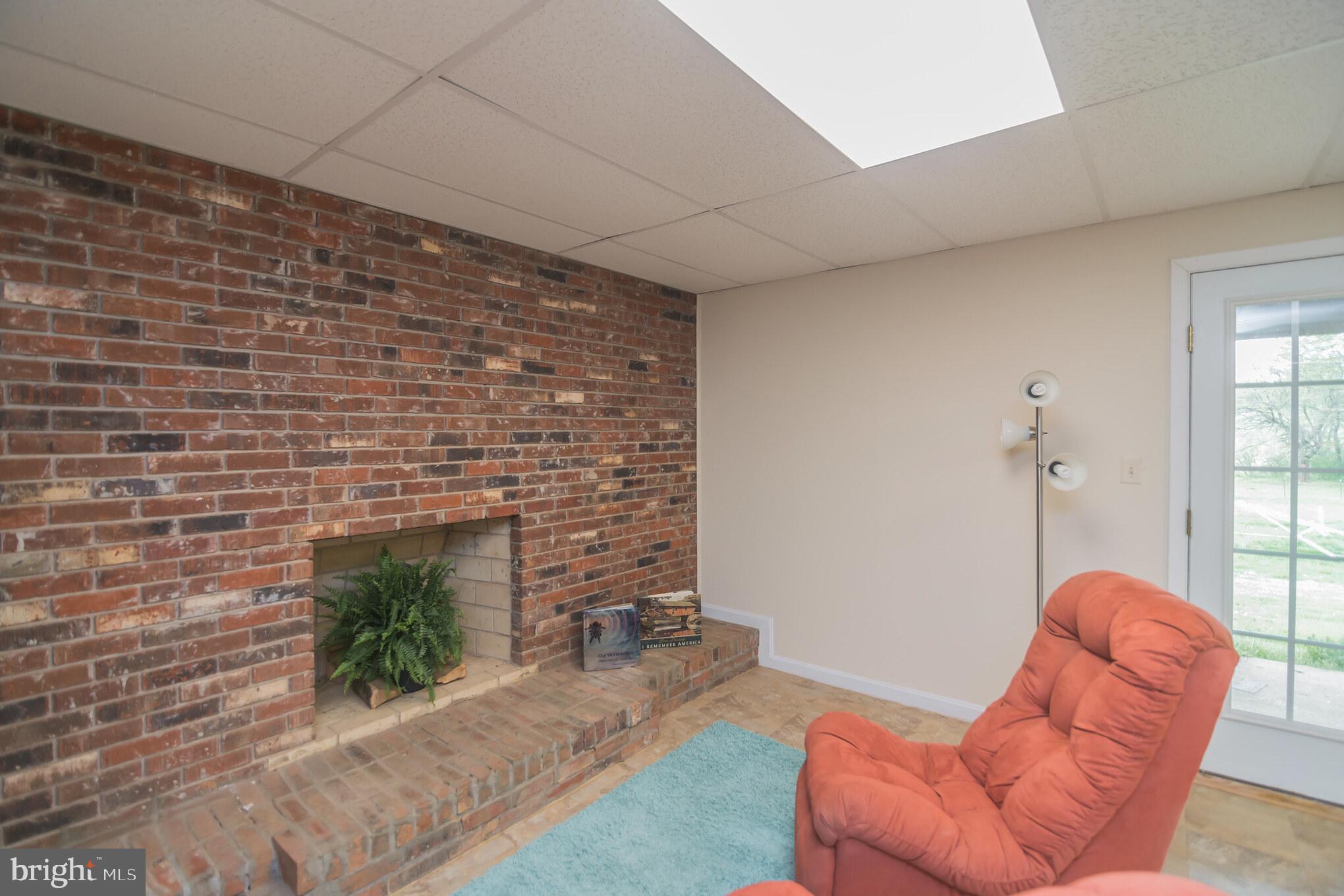 6156 Georgetown Road Broad Run, VA 20137 - Photo 26 of 40 Lower level with cozy fire place