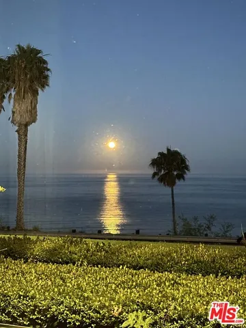 a view of a street with a yard