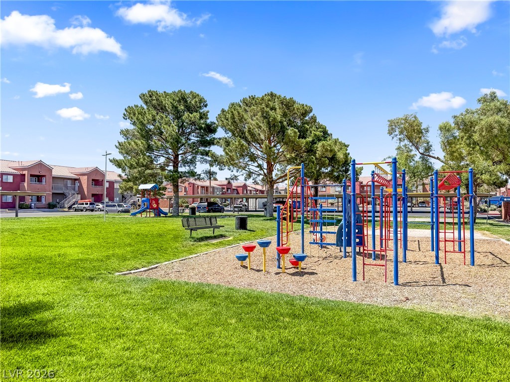 4730 East Craig Road, Unit 1053 Las Vegas, NV 89115 - Photo 26 of 32 A vibrant playground surrounded by lush green space, perfect for outdoor enjoyment.
