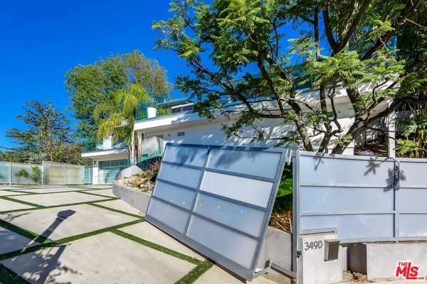 a view of a backyard with a sitting area