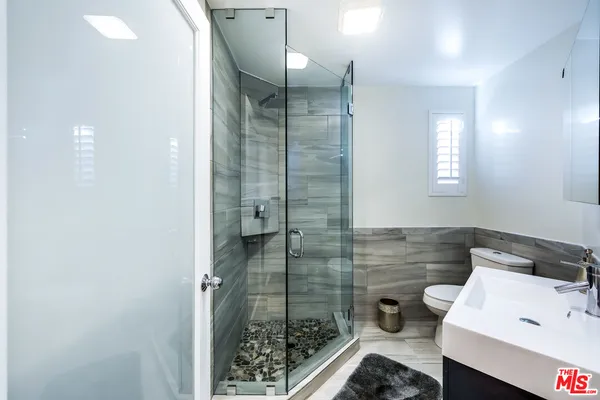 a bathroom with a sink and a shower