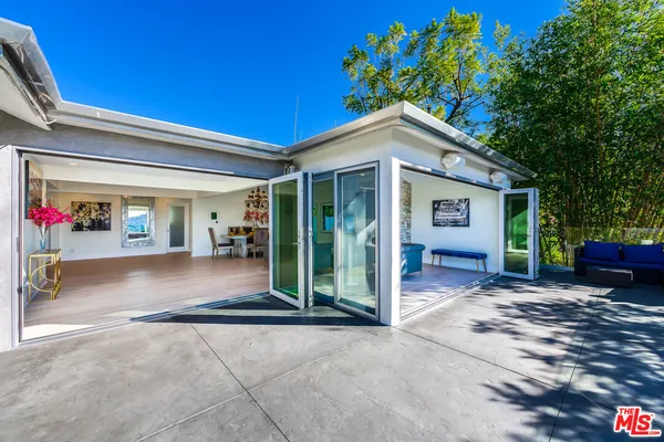 a view of a house with a outdoor space and porch