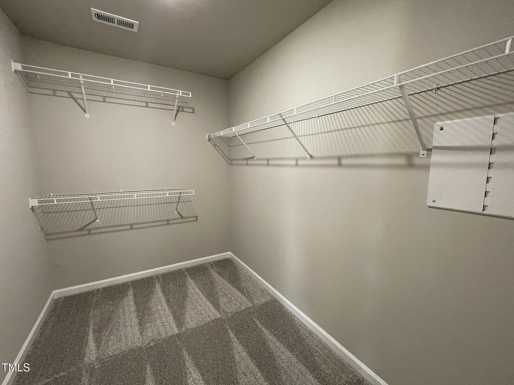 168 Oakfield Trce Drive Four Oaks, NC 27524 - Photo 12 of 19 a view of a room with racks on the wall