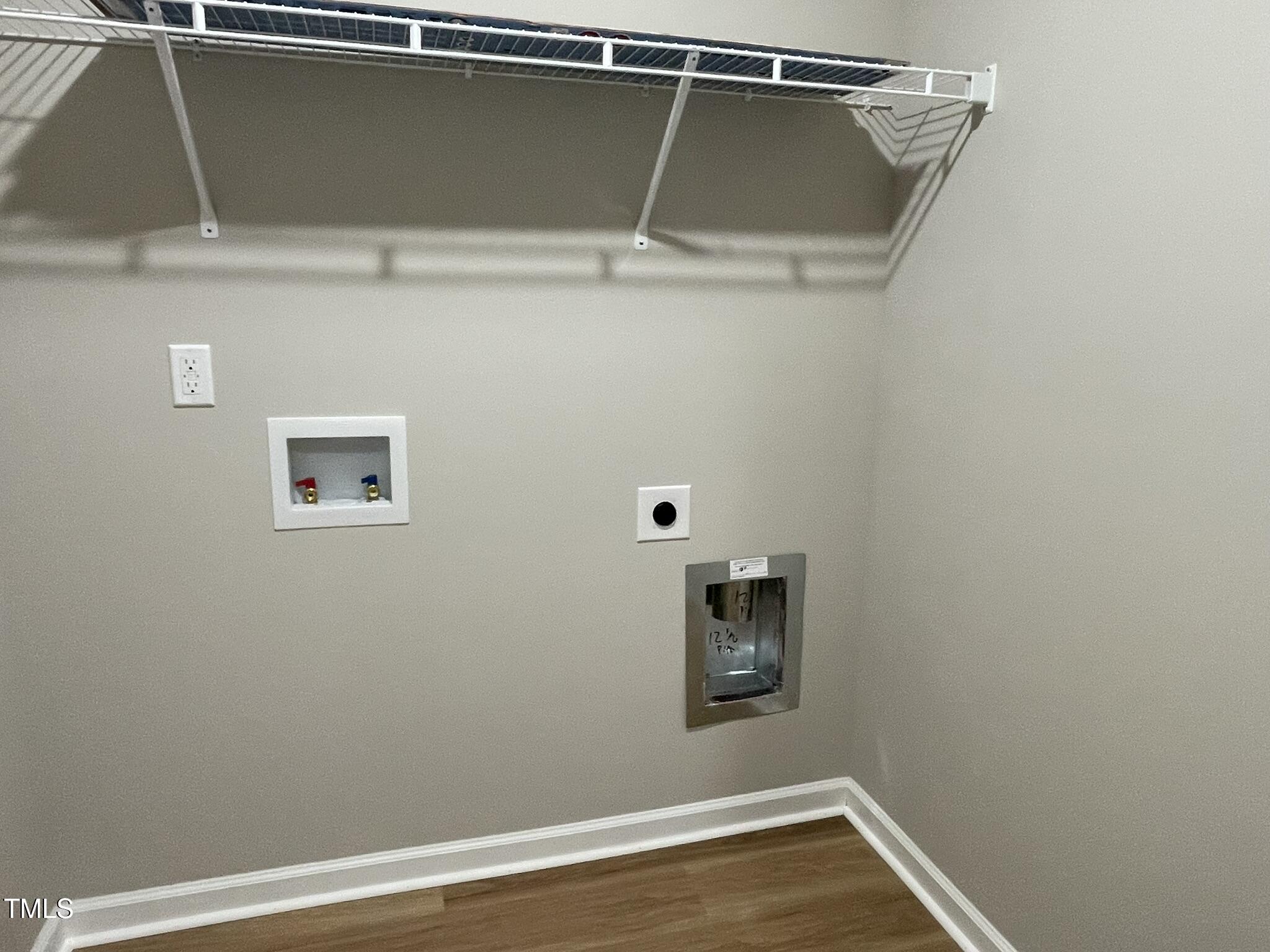 168 Oakfield Trce Drive Four Oaks, NC 27524 - Photo 13 of 19 a view of a room with rack and wooden floor