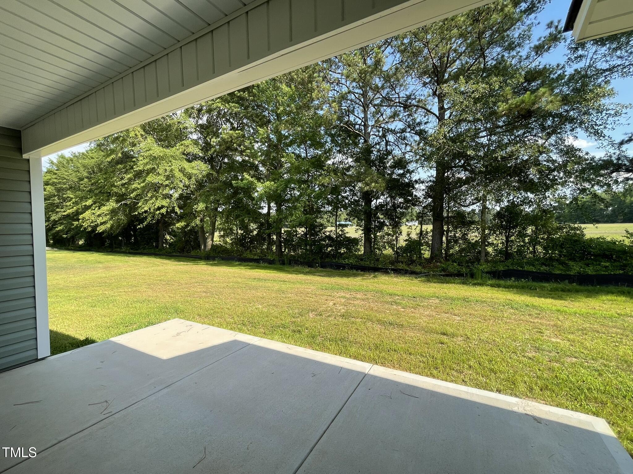 168 Oakfield Trce Drive Four Oaks, NC 27524 - Photo 17 of 19 a view of a yard with an outdoor space