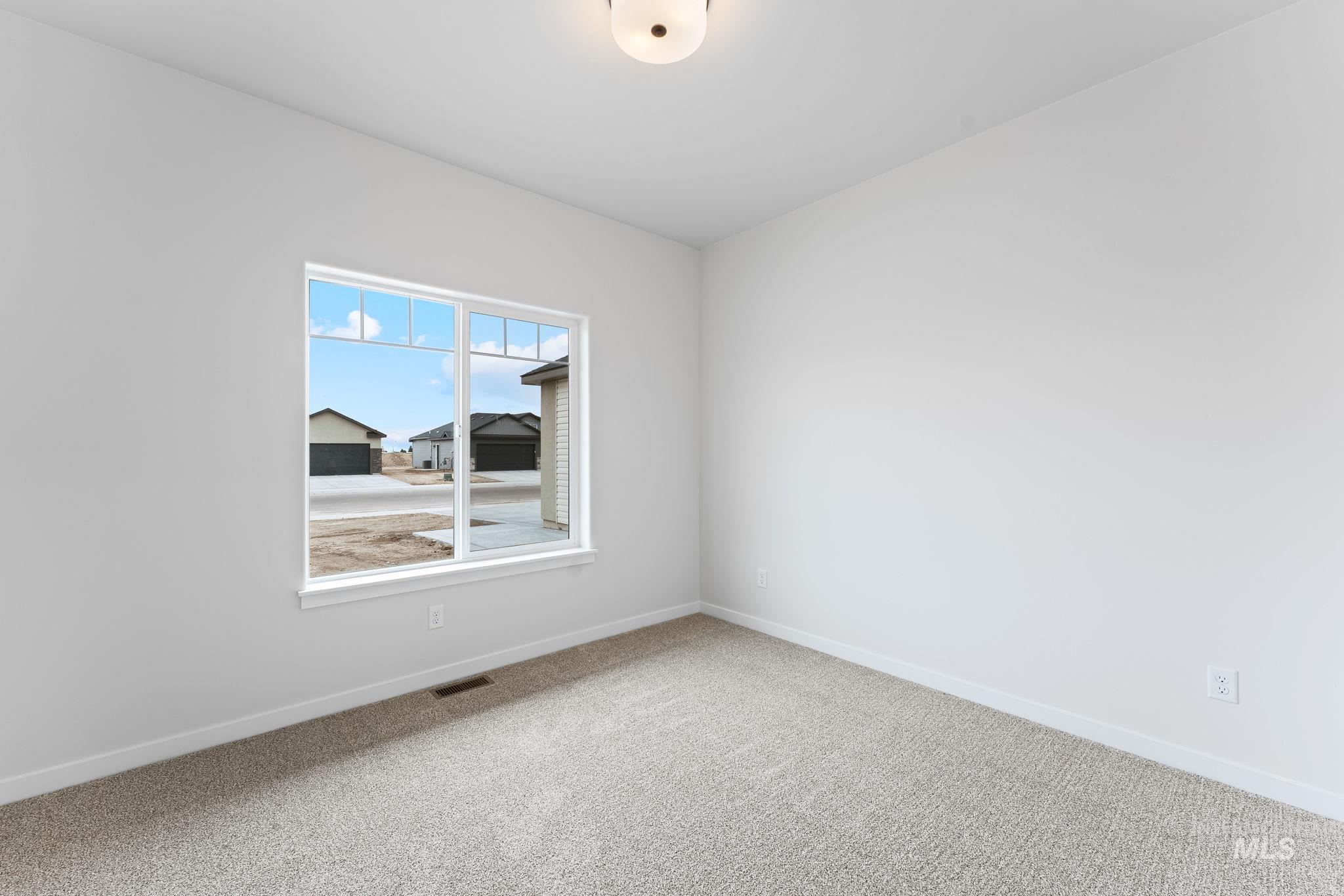 2220 Great Basin Way Burley, ID 83318 - Photo 27 of 39 Empty room featuring baseboards and light colored carpet