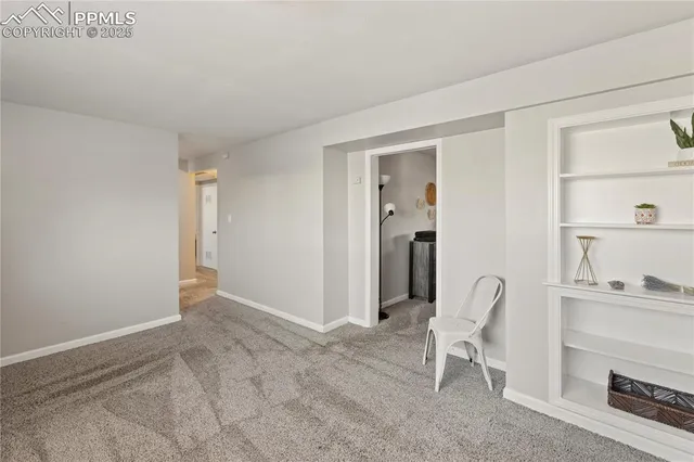a view of room with furniture and a rug