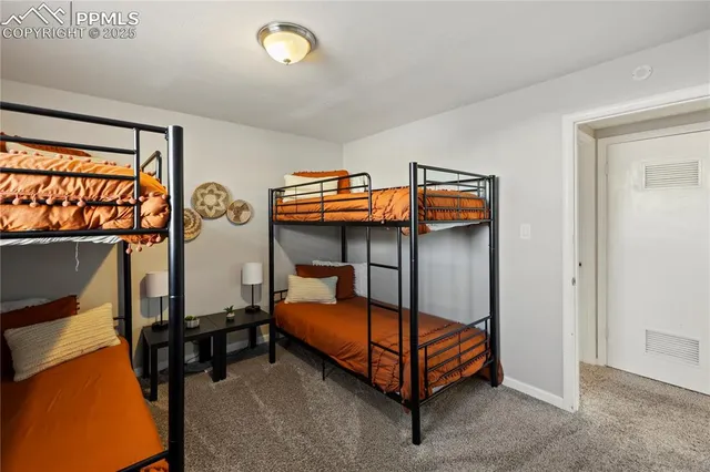 a bedroom with bed and a window