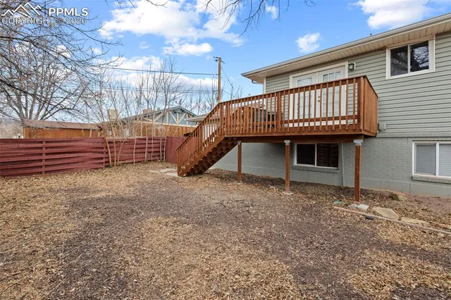 a view of house with a yard