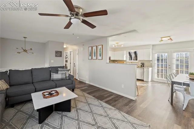 a living room with furniture and a table