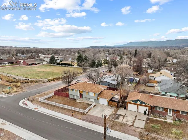 an aerial view of residential houses with outdoor space