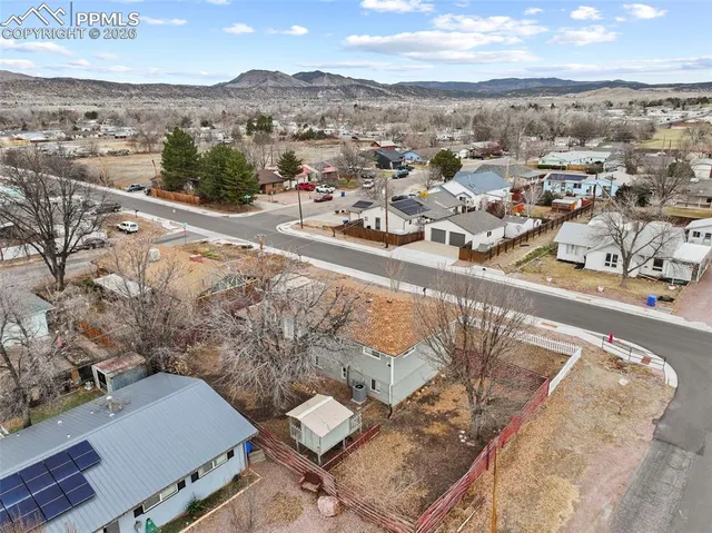 an aerial view of residential houses with outdoor space