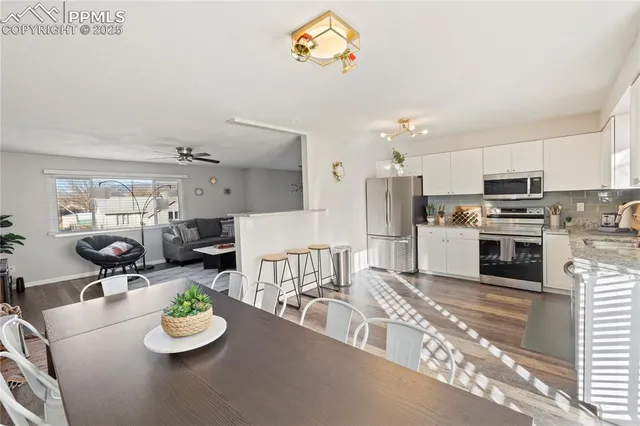 a kitchen with sink refrigerator and stove