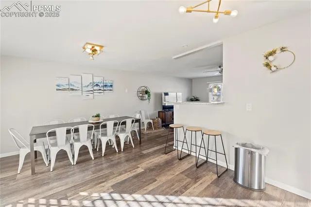 a view of a dining room with wooden floor