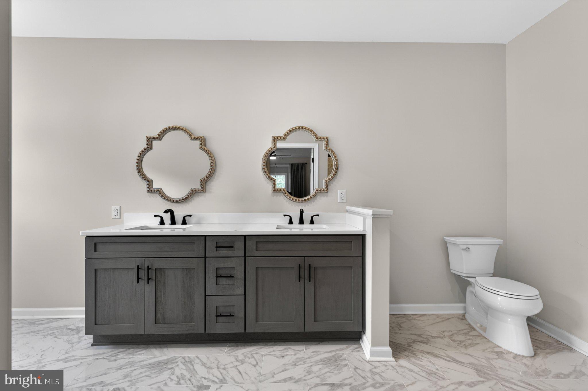 836 Hardingville Road Monroeville, NJ 08343 - Photo 27 of 58 Elegant dual-sink bathroom retreat.