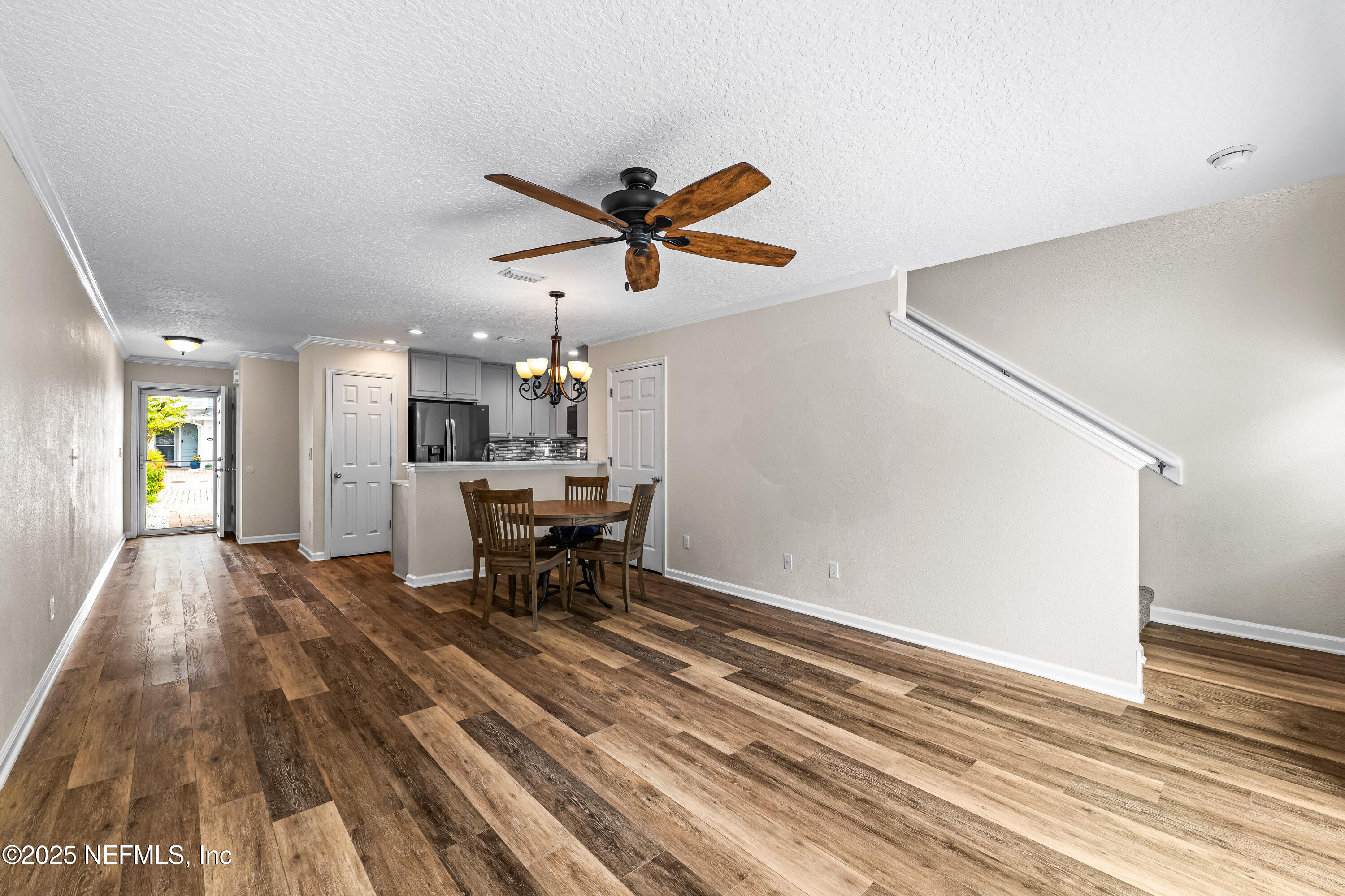 295 Islander Circle St. Augustine, FL 32080 - Photo 13 of 34 a living room with furniture and a table