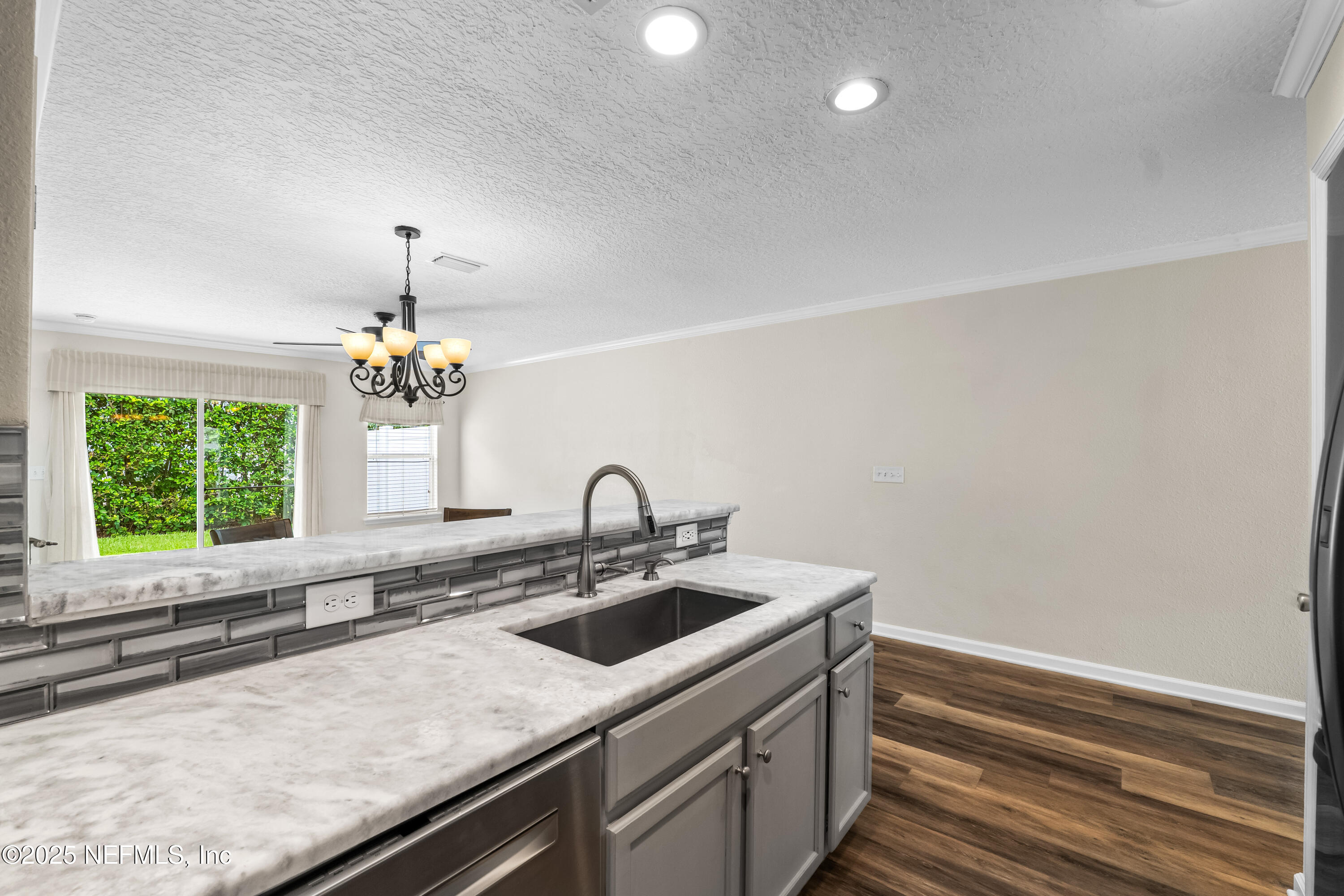 295 Islander Circle St. Augustine, FL 32080 - Photo 18 of 34 a kitchen with a sink and a window