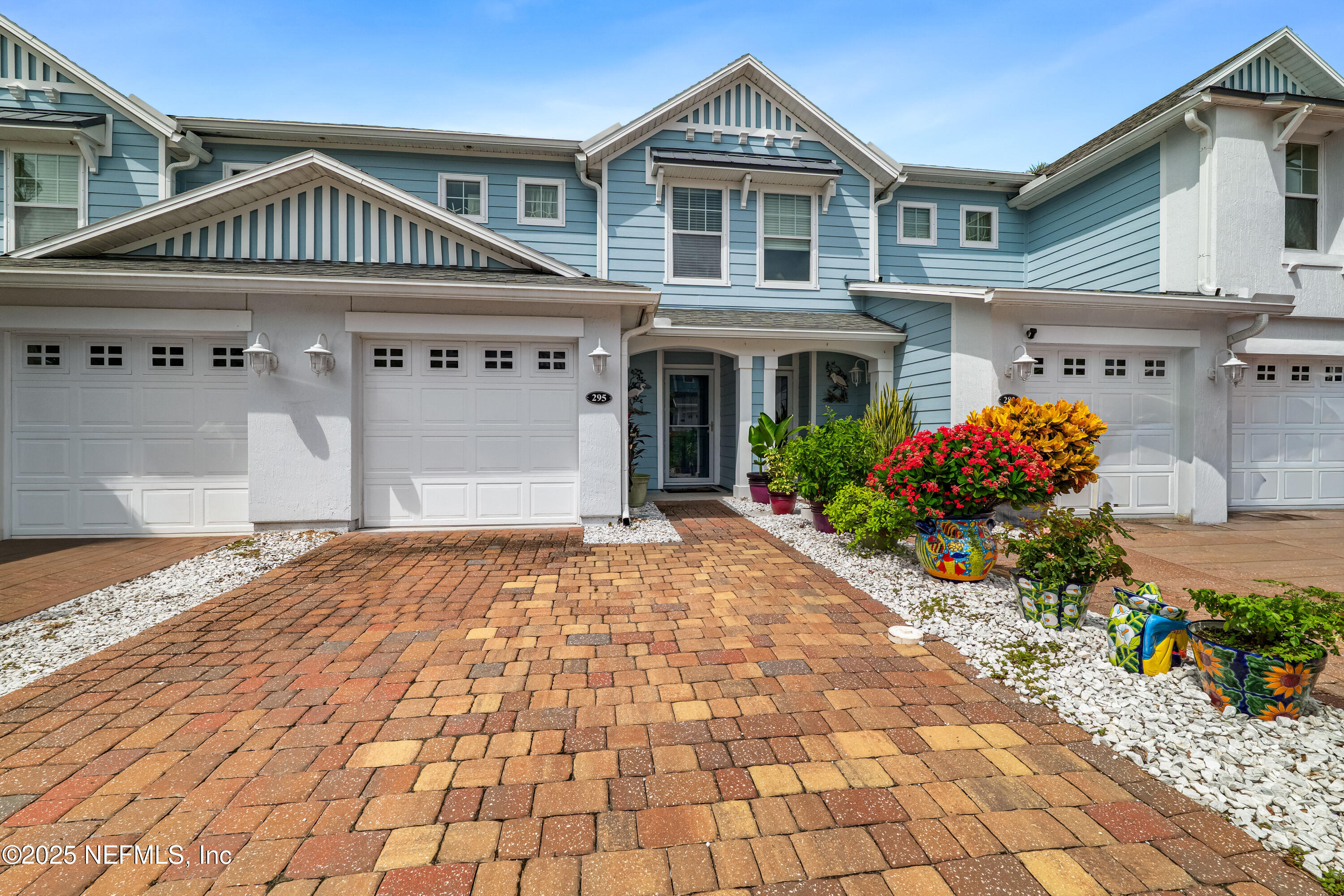 295 Islander Circle St. Augustine, FL 32080 - Photo 2 of 34 a front view of a house with a yard