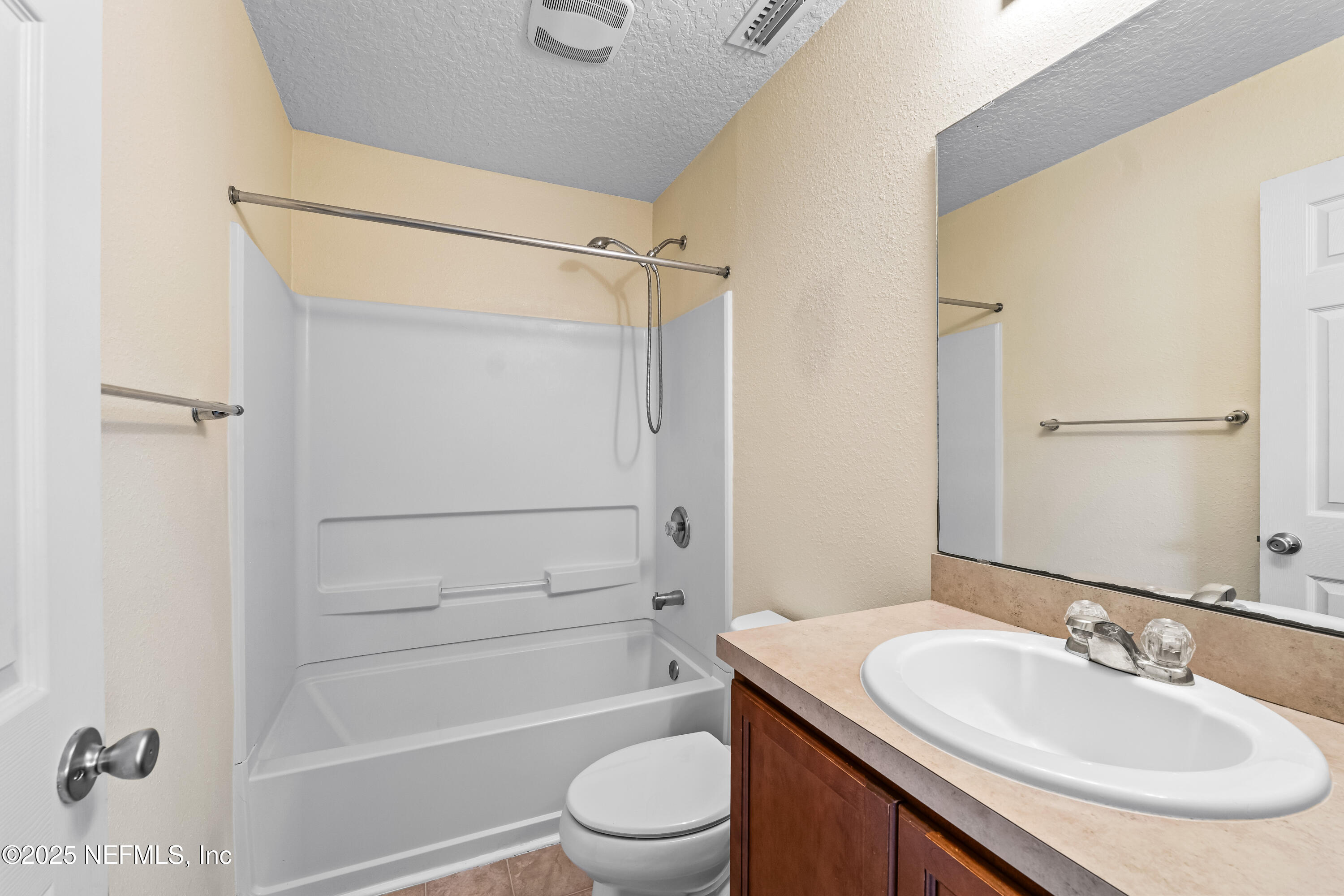 295 Islander Circle St. Augustine, FL 32080 - Photo 31 of 34 a bathroom with a granite countertop sink toilet and shower