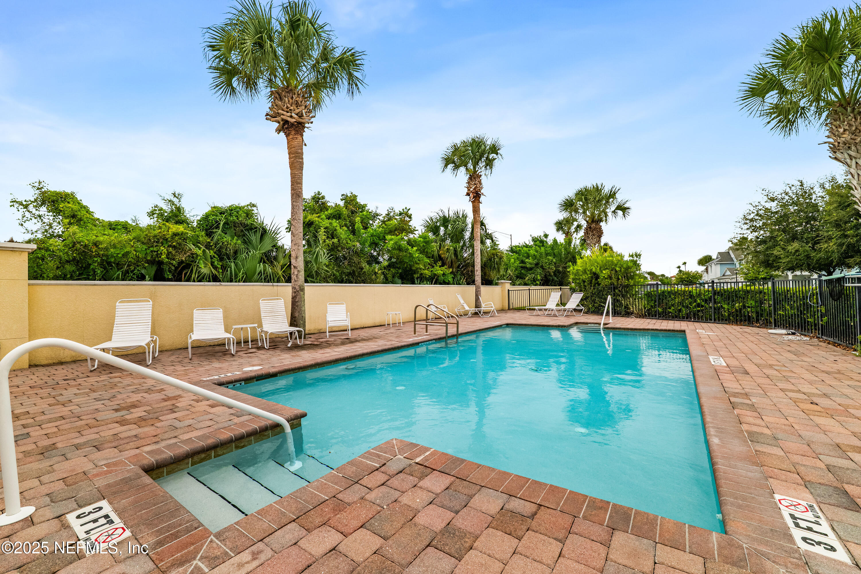 295 Islander Circle St. Augustine, FL 32080 - Photo 7 of 34 a view of a swimming pool with a yard
