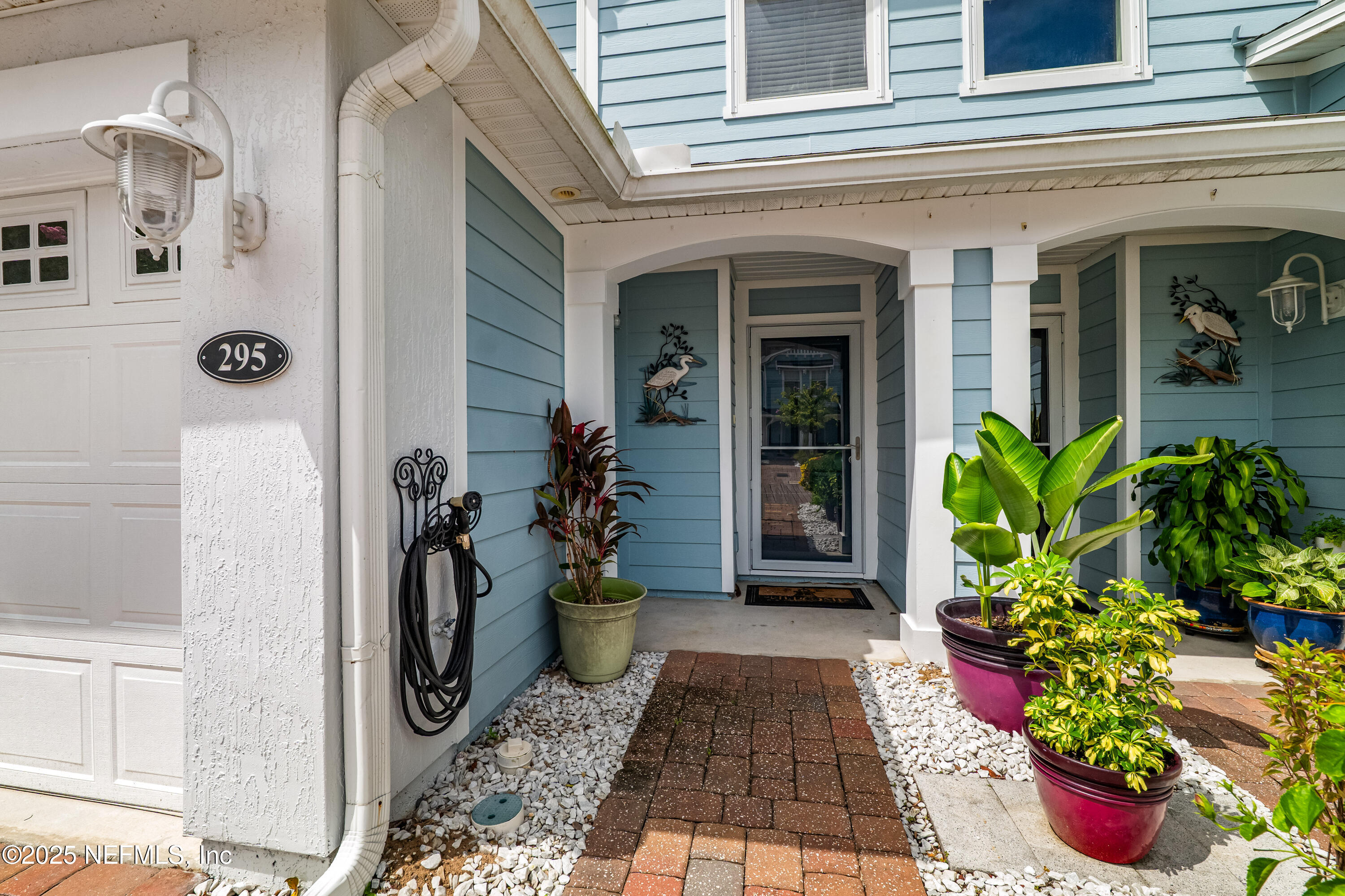 295 Islander Circle St. Augustine, FL 32080 - Photo 8 of 34 a front view of a house with a porch