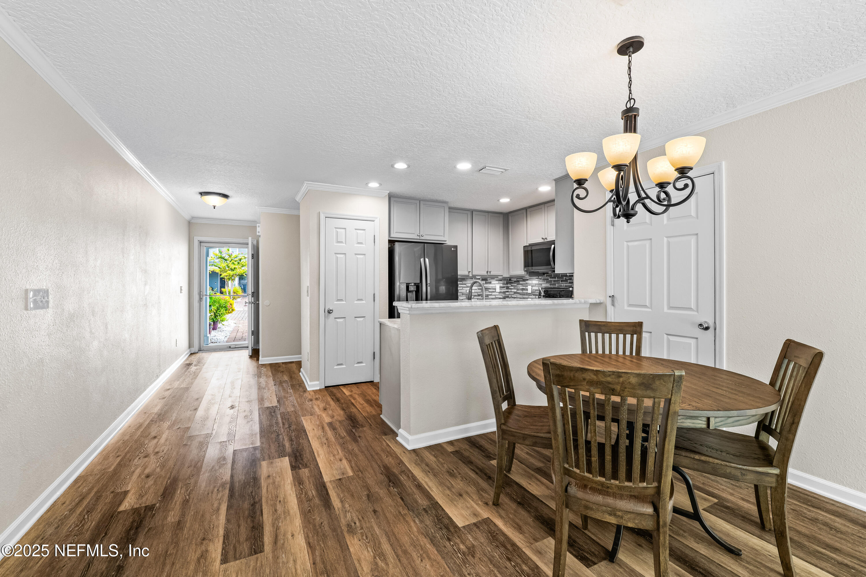 295 Islander Circle St. Augustine, FL 32080 - Photo 9 of 34 a view of a dining room with furniture window and wooden floor