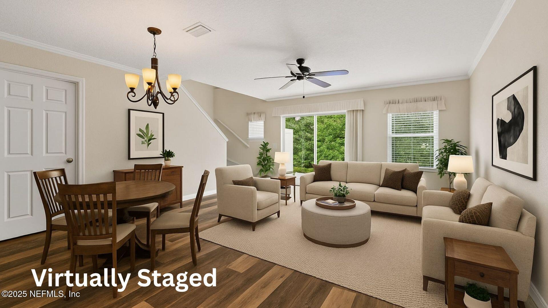 295 Islander Circle St. Augustine, FL 32080 - Photo 10 of 34 a living room with furniture a chandelier and a dining table