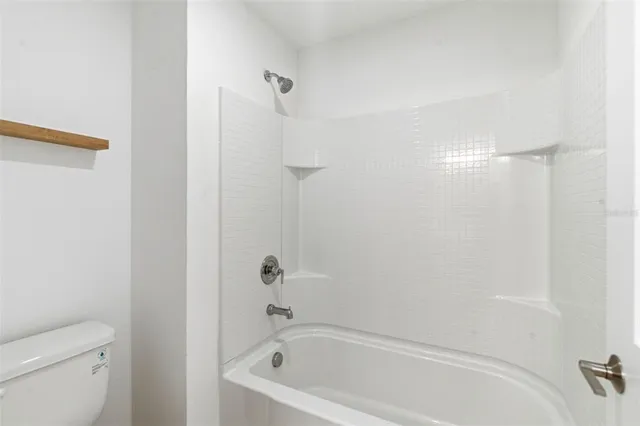 an aerial view of a house with a swimming pool