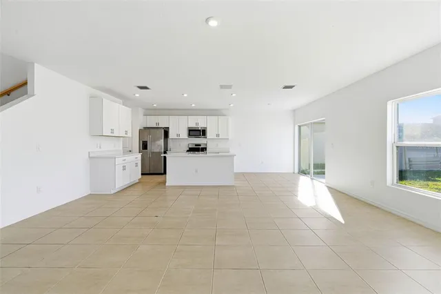 a kitchen with stainless steel appliances a refrigerator and a sink