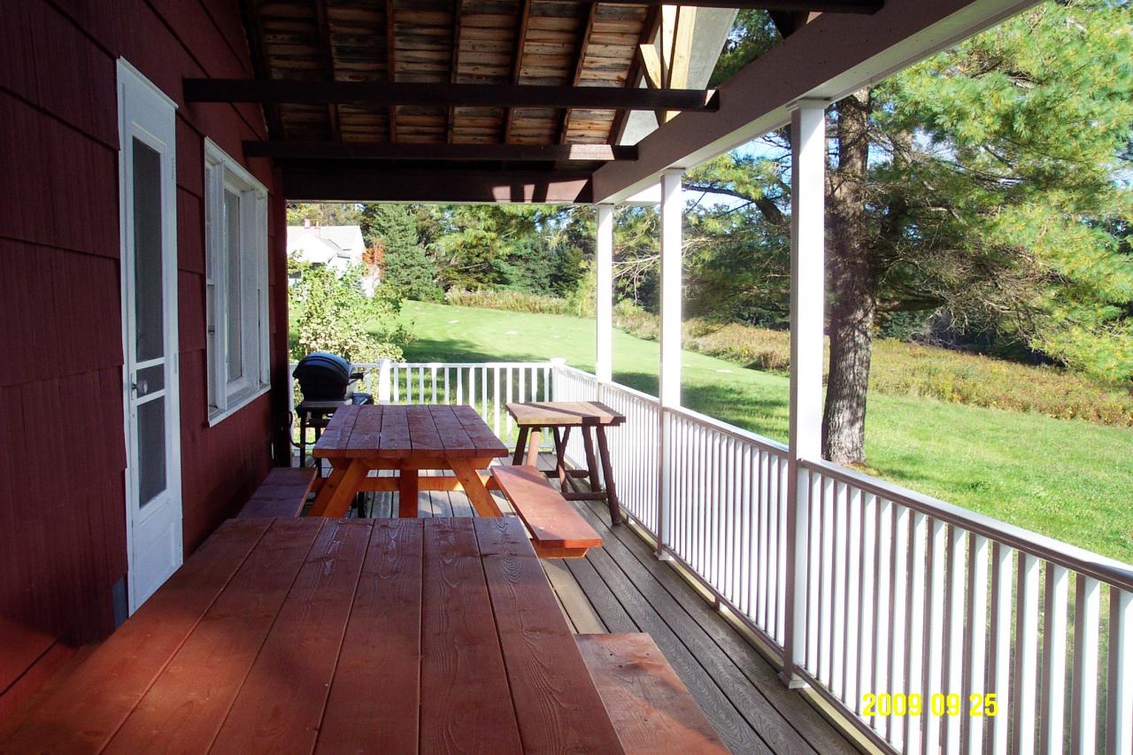 87 Curtin Road Peru, MA 01235 - Photo 2 of 17 a view of a chair and table in the balcony