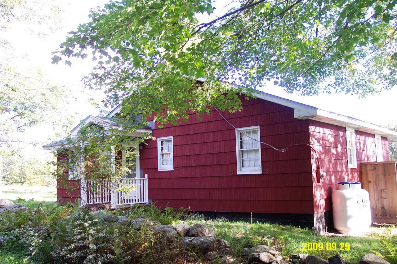 87 Curtin Road Peru, MA 01235 - Photo 3 of 17 a view of a wooden door and a tree