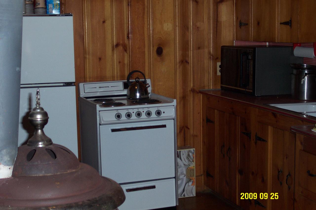 87 Curtin Road Peru, MA 01235 - Photo 10 of 17 a kitchen with a stove and a refrigerator