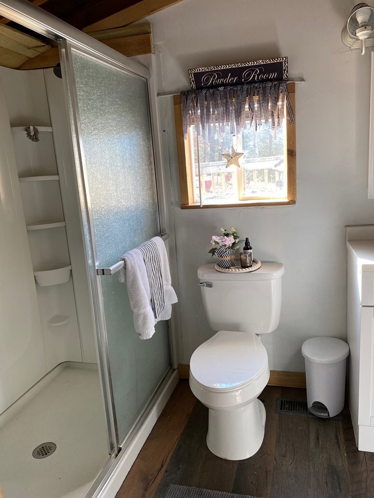 1174 Sharp Road Sevierville, TN 37876 - Photo 10 of 30 a bathroom with a toilet and a shower