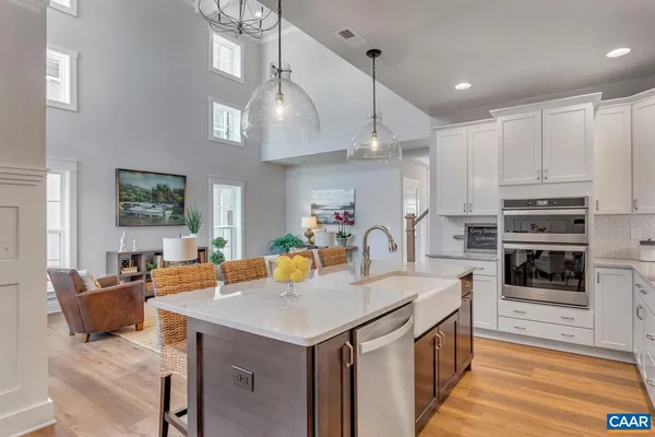 a kitchen with a stove a refrigerator and a sink