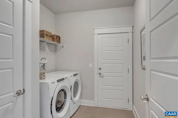 a view of storage and utility room with washer and dryer