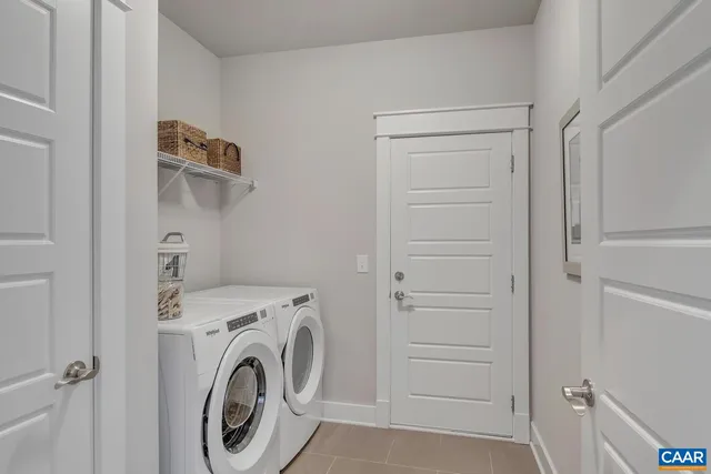 a view of storage and utility room with washer and dryer