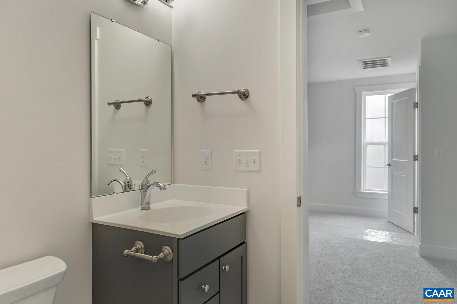 29 Portelet Road Crozet, VA 22932 - Photo 20 of 28 a bathroom with a sink and a mirror
