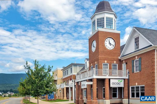 a front view of a building with a yard