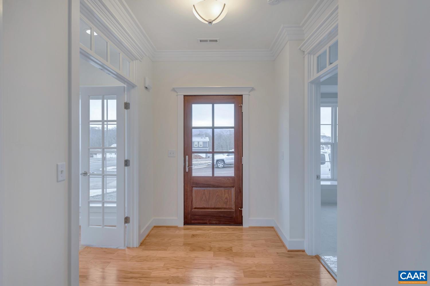 29 Portelet Road Crozet, VA 22932 - Photo 3 of 28 a bedroom with a bed and wooden floor