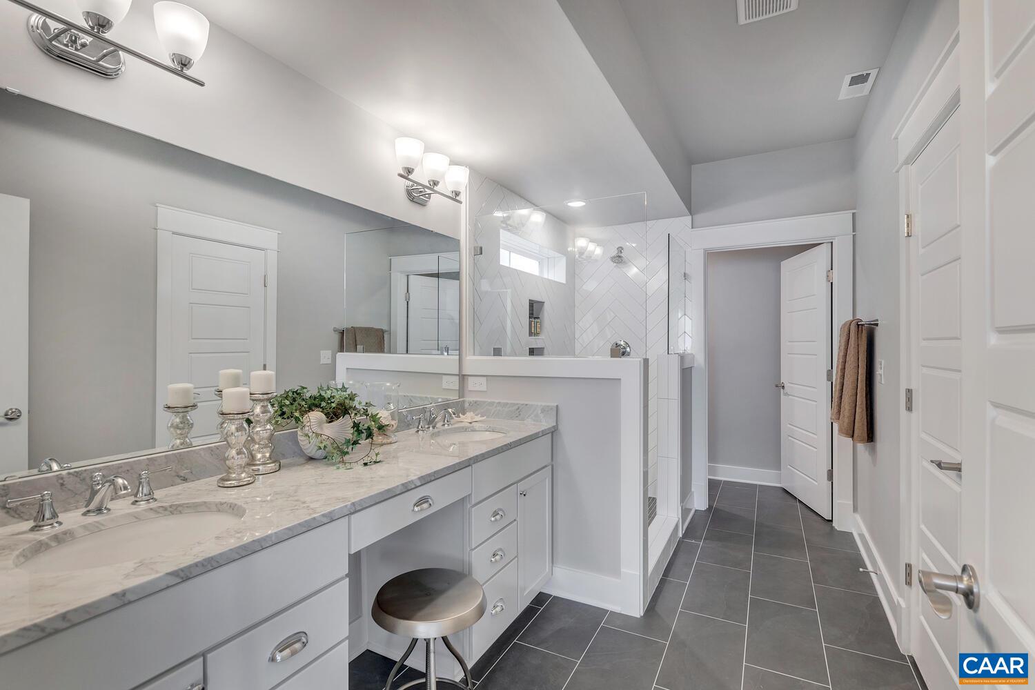 29 Portelet Road Crozet, VA 22932 - Photo 8 of 28 a bathroom with a double vanity sink and a mirror