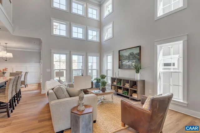 a living room with fireplace furniture and a wooden floor