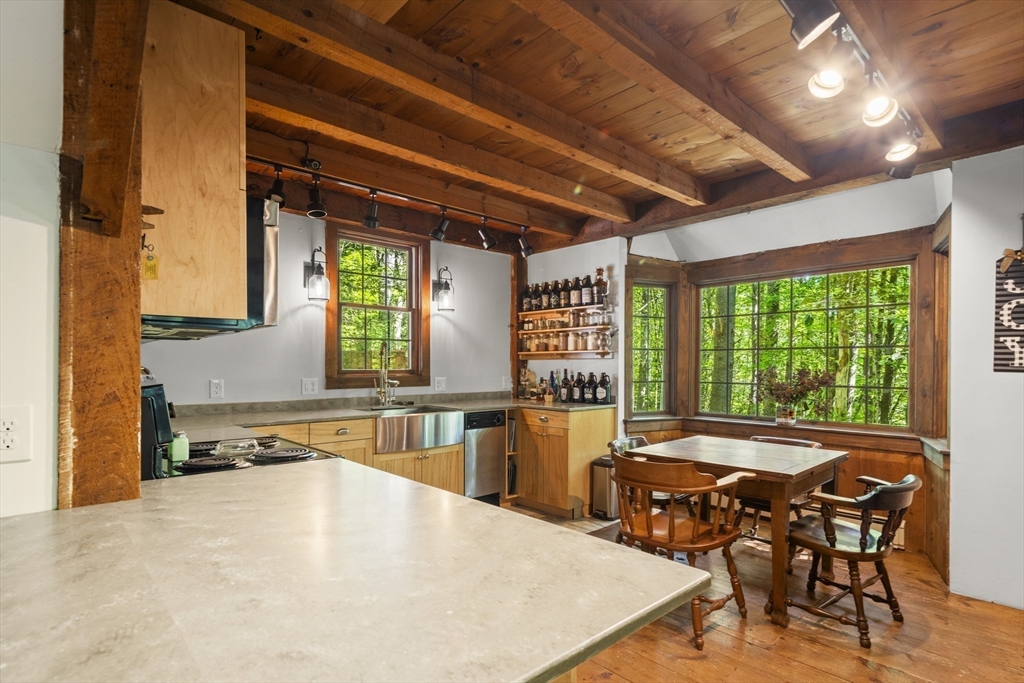 180 Holtshire Road Orange, MA 01364 - Photo 11 of 22 a dining table with chairs and window