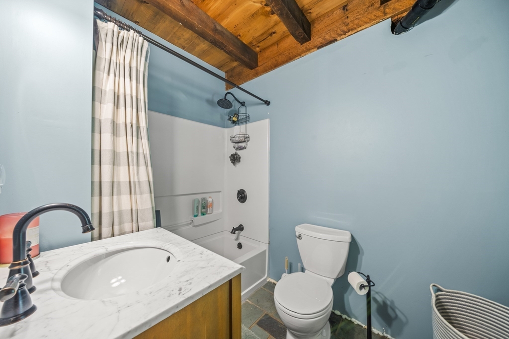 180 Holtshire Road Orange, MA 01364 - Photo 14 of 22 a bathroom with a sink toilet and shower