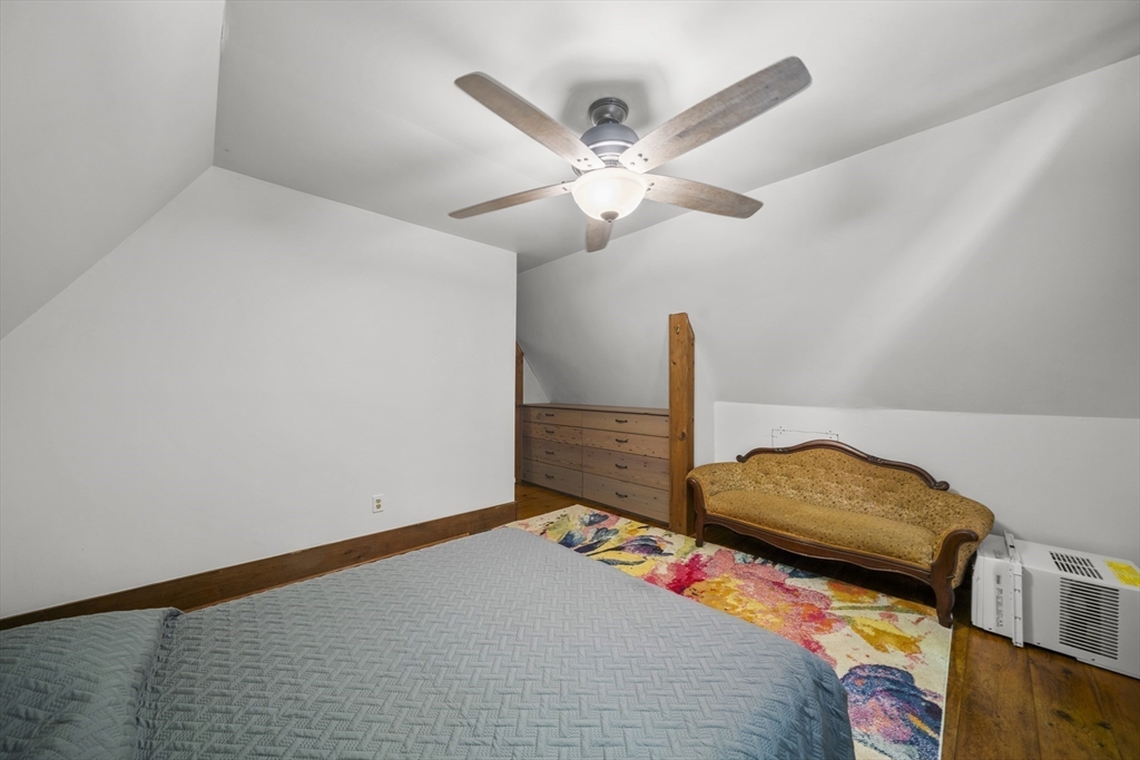 180 Holtshire Road Orange, MA 01364 - Photo 17 of 22 a bedroom with a bed and a ceiling fan