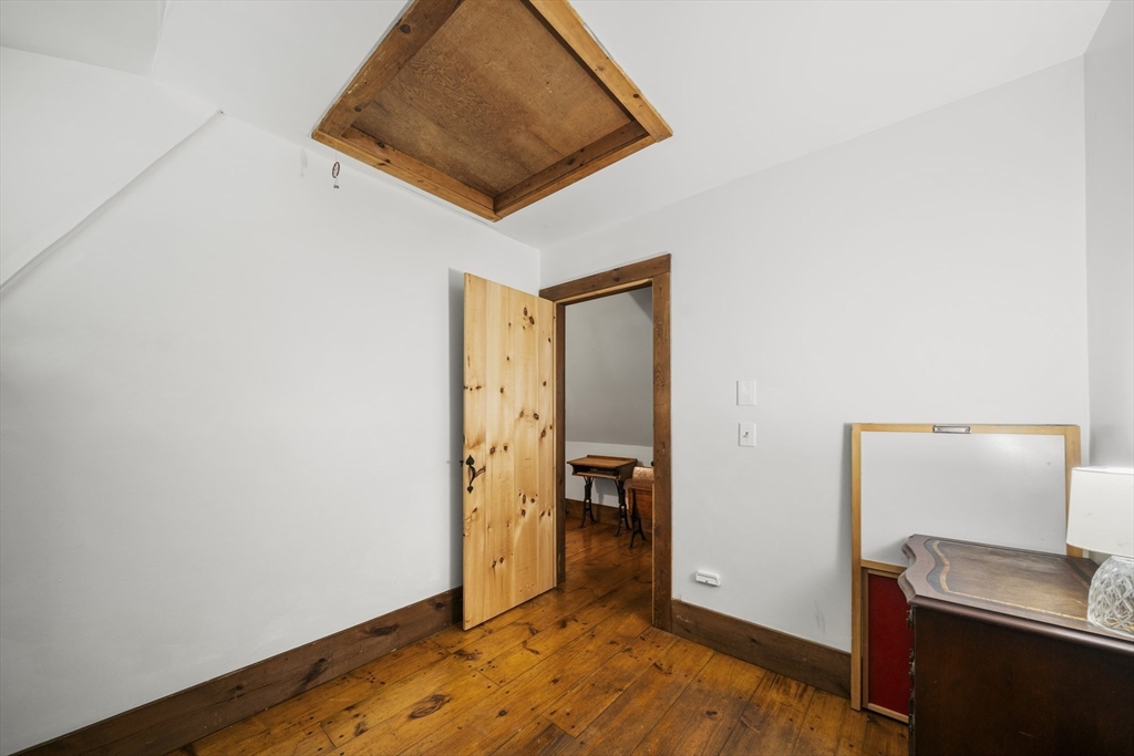 180 Holtshire Road Orange, MA 01364 - Photo 18 of 22 a view of an empty room and wooden floor