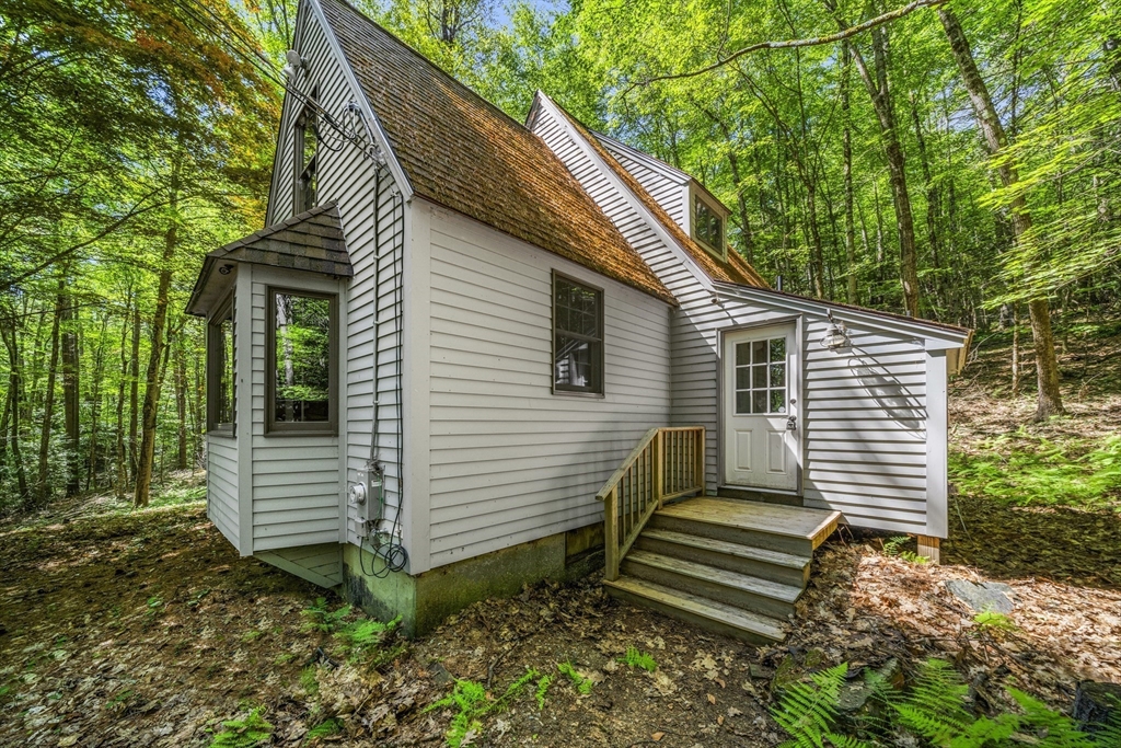 180 Holtshire Road Orange, MA 01364 - Photo 4 of 22 a view of a house with a yard