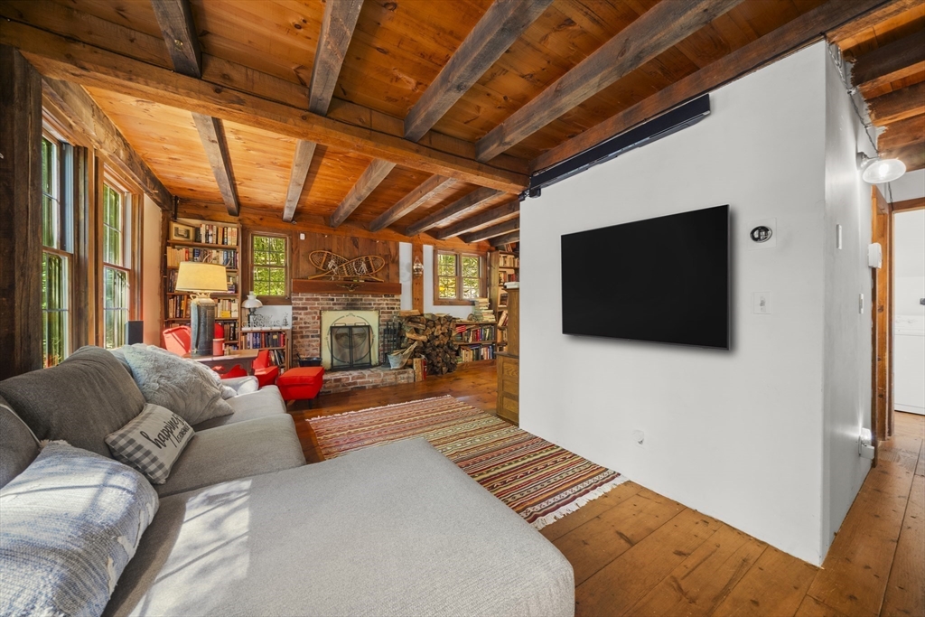 180 Holtshire Road Orange, MA 01364 - Photo 6 of 22 a living room with furniture and a flat screen tv