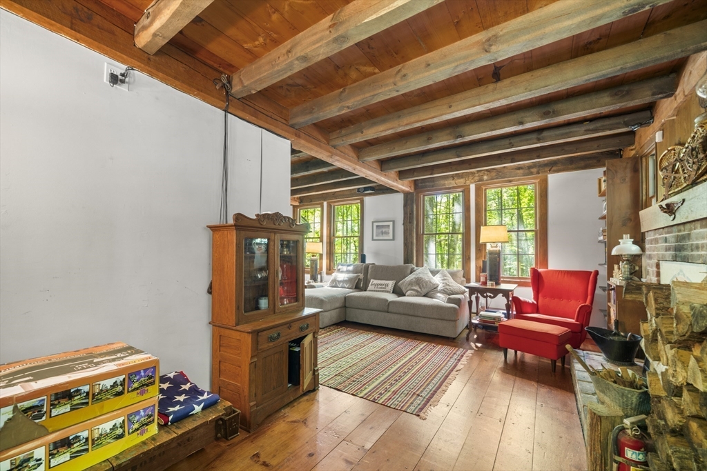 180 Holtshire Road Orange, MA 01364 - Photo 7 of 22 a living room with furniture and a wooden floor